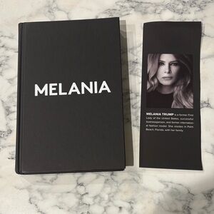 Melania Black Hardcover Book